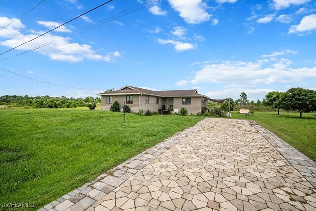 ranch-style home with a front yard