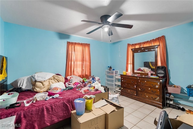 bedroom featuring light tile patterned flooring and ceiling fan