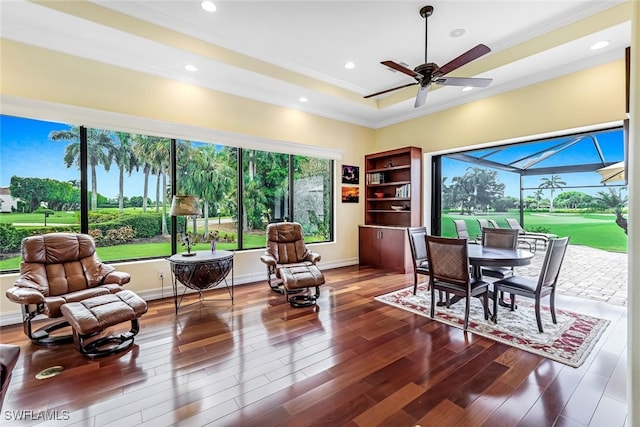 interior space with a ceiling fan, recessed lighting, wood finished floors, and baseboards