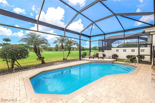 view of pool featuring a patio area and a lanai