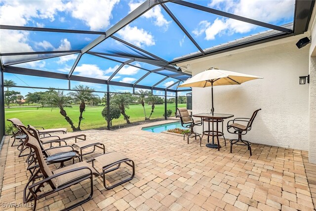 view of patio featuring a lanai