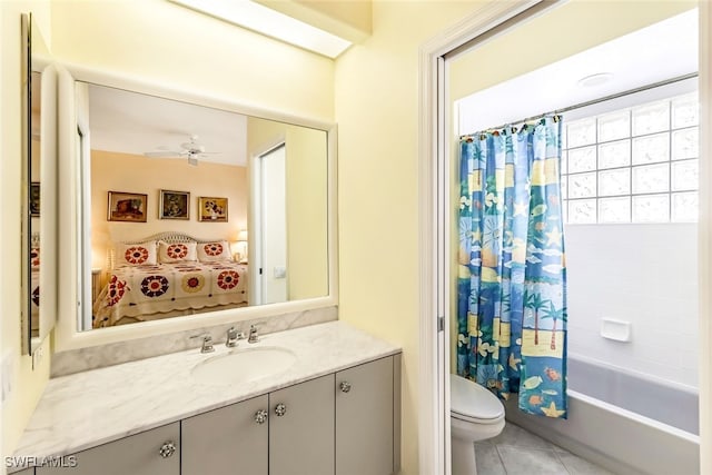 bathroom with vanity, ceiling fan, tile patterned flooring, shower / tub combo, and toilet