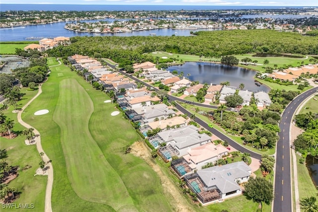 aerial view with view of golf course, a water view, and a residential view