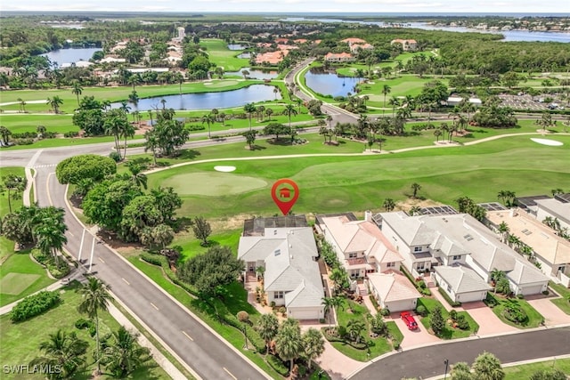 birds eye view of property featuring a residential view, a water view, and view of golf course