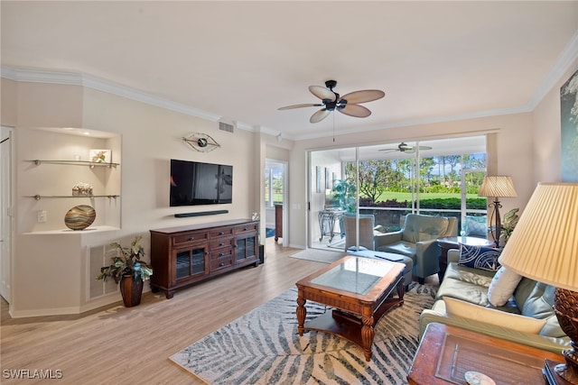 living room with crown molding, ceiling fan, and light hardwood / wood-style floors