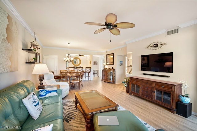 living room featuring crown molding, light hardwood / wood-style flooring, and ceiling fan