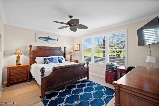 bedroom with ornamental molding, hardwood / wood-style floors, and ceiling fan