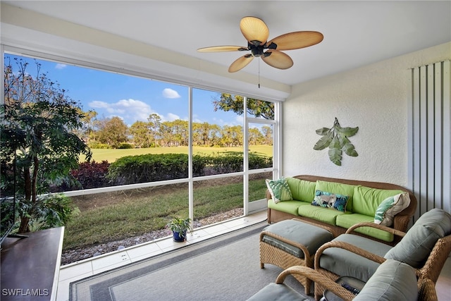 sunroom featuring ceiling fan