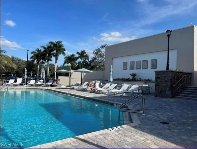 view of swimming pool featuring a patio