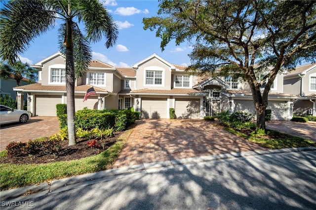 multi unit property featuring a garage