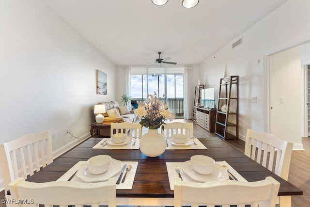 dining room featuring dark wood-type flooring and ceiling fan