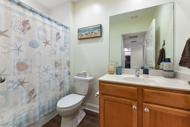 bathroom featuring vanity, toilet, and a shower with shower curtain