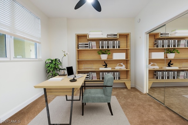 carpeted office with ceiling fan