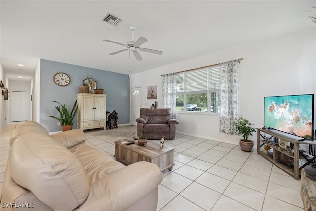 tiled living room featuring ceiling fan