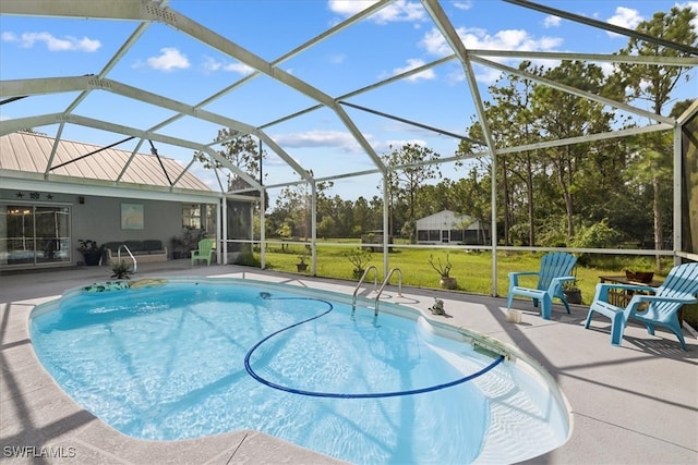 view of swimming pool featuring glass enclosure, a yard, and a patio