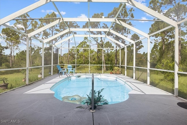 view of swimming pool featuring a patio and glass enclosure