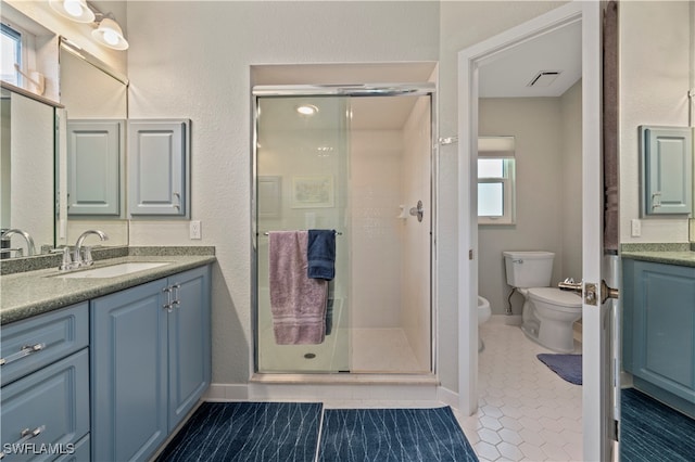 bathroom featuring vanity, tile patterned flooring, a bidet, and a shower with shower door