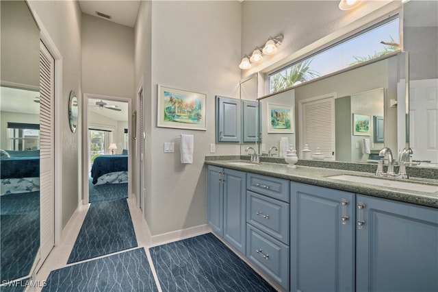 bathroom with ceiling fan and vanity