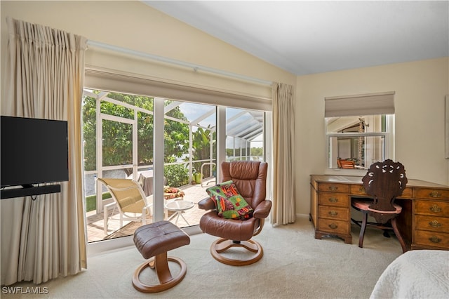 carpeted bedroom with access to outside and lofted ceiling