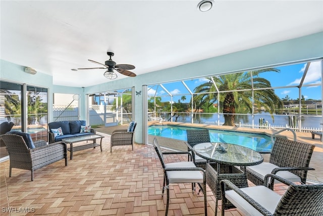 exterior space with a water view and ceiling fan