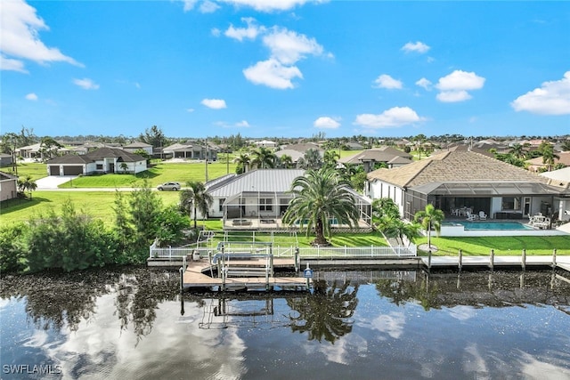 dock area featuring a lawn, a water view, and a lanai