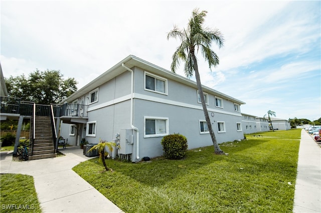 view of home's exterior with a lawn