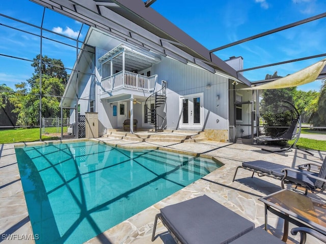 view of pool featuring french doors and a patio area