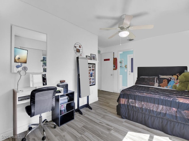 bedroom with light hardwood / wood-style floors and ceiling fan