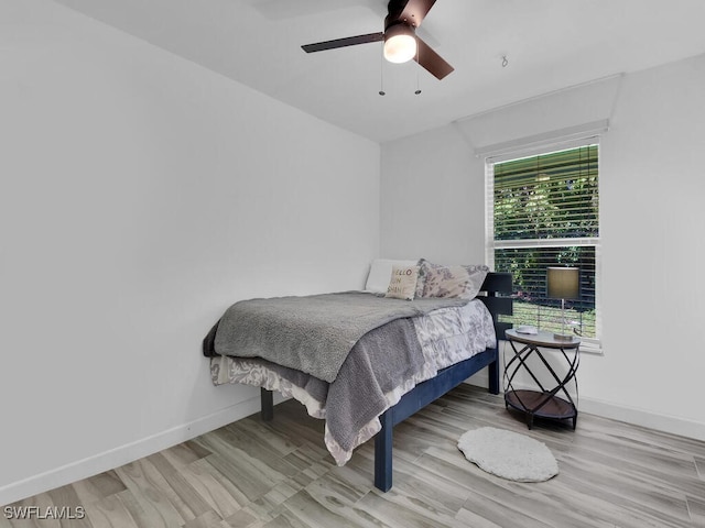 bedroom featuring light wood-type flooring and ceiling fan