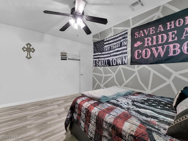 bedroom featuring ceiling fan and wood-type flooring