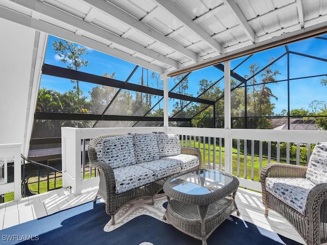 view of patio featuring glass enclosure