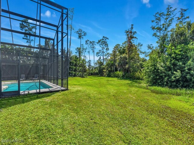 view of yard featuring a lanai