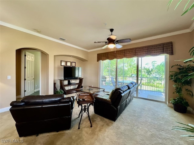 living room featuring crown molding, light colored carpet, and ceiling fan