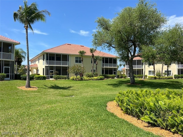 back of house featuring a yard