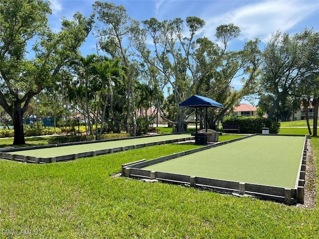 view of home's community with a yard