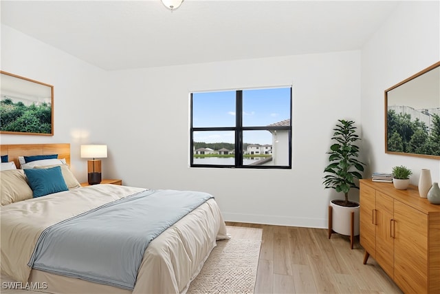 bedroom with light wood-type flooring