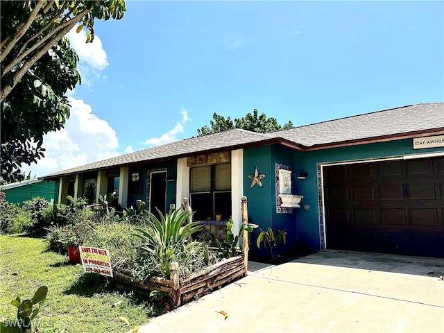 single story home featuring a garage