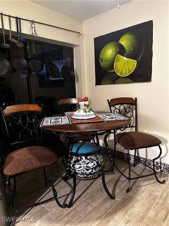 dining space with light hardwood / wood-style floors