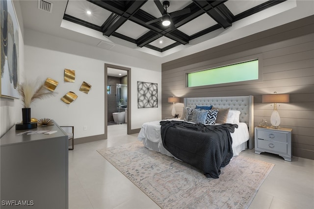 bedroom with ensuite bathroom, coffered ceiling, wood walls, ceiling fan, and beam ceiling