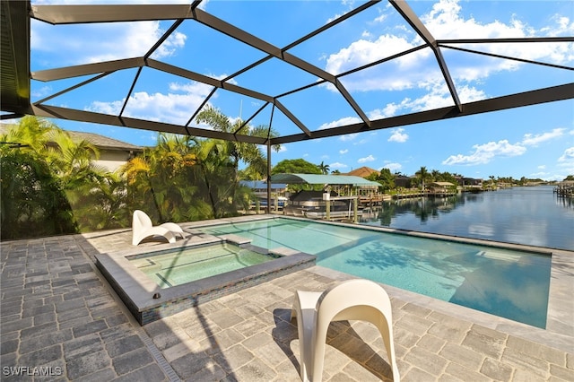 view of pool featuring a water view, a lanai, a patio, and an in ground hot tub