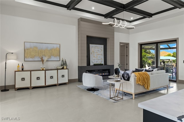 living room with coffered ceiling, a large fireplace, and beamed ceiling