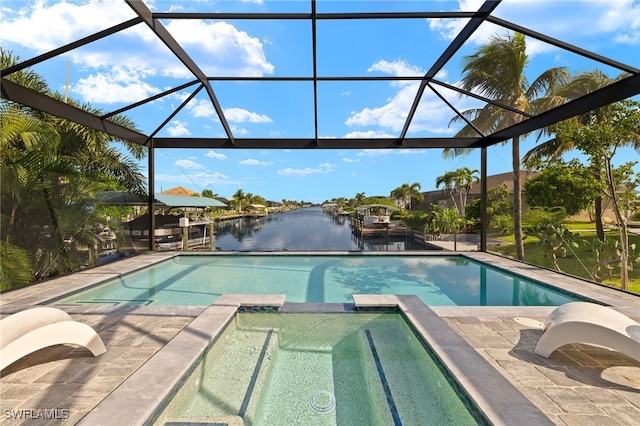 view of swimming pool featuring a lanai, a water view, and a patio