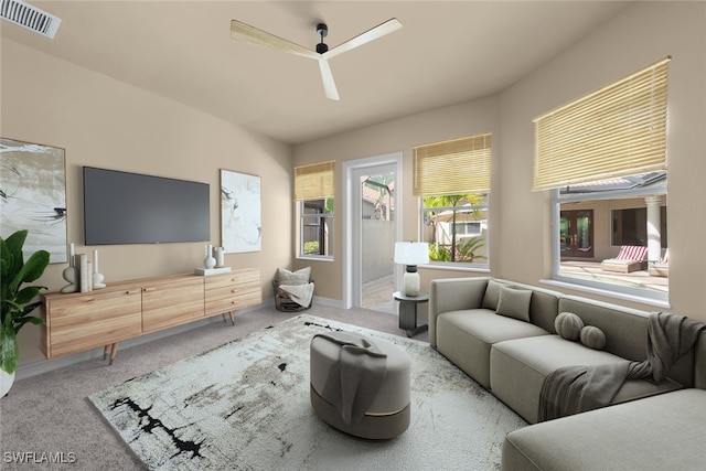 carpeted living room with ceiling fan