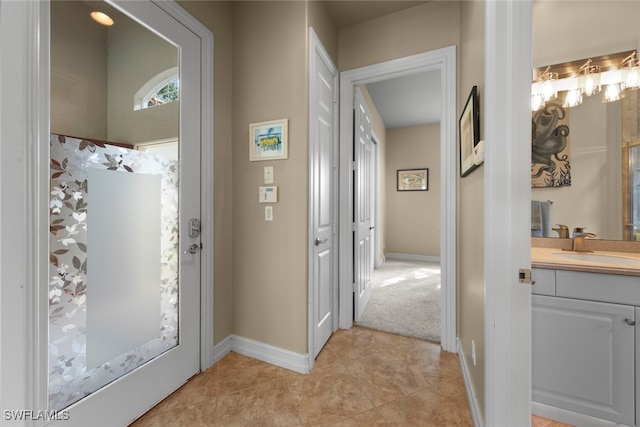 interior space featuring tile patterned flooring and vanity