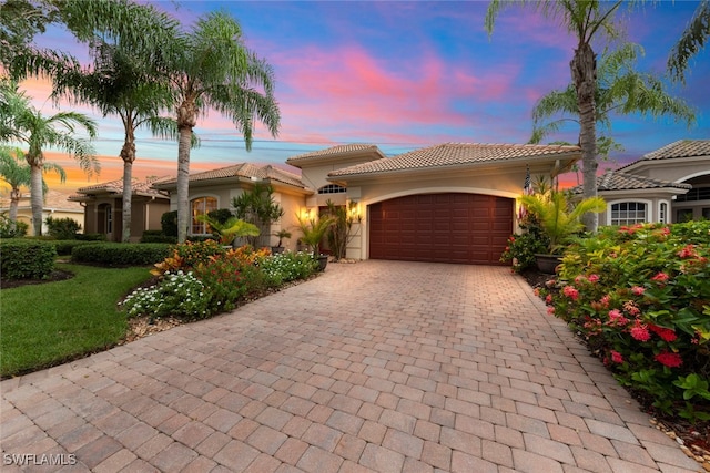 mediterranean / spanish-style house featuring a garage