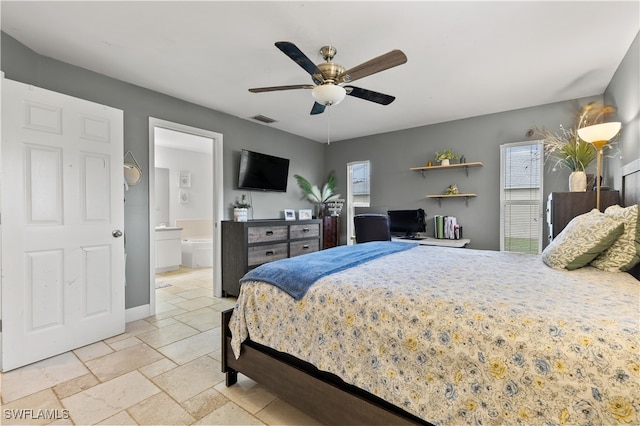 bedroom with ceiling fan and ensuite bath