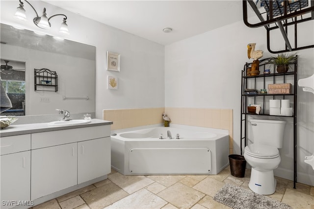 bathroom with a tub to relax in, toilet, and vanity