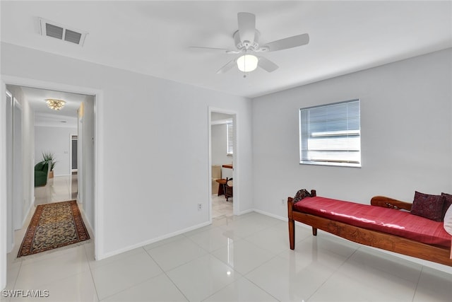 tiled bedroom with ceiling fan