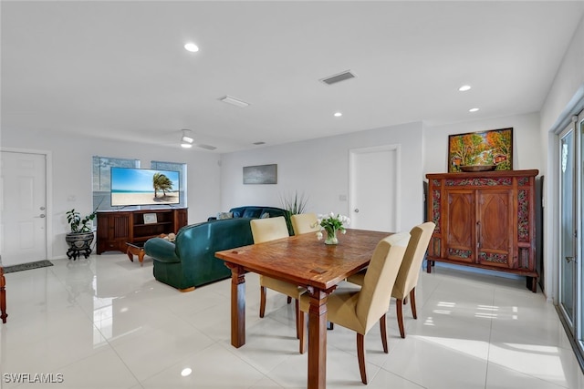 dining space with light tile patterned floors