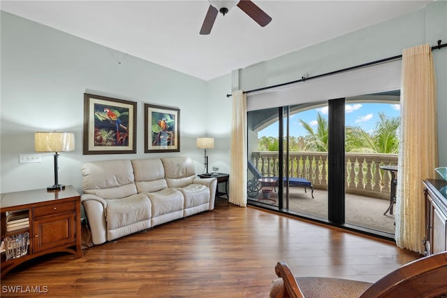 living room featuring ceiling fan and wood-type flooring